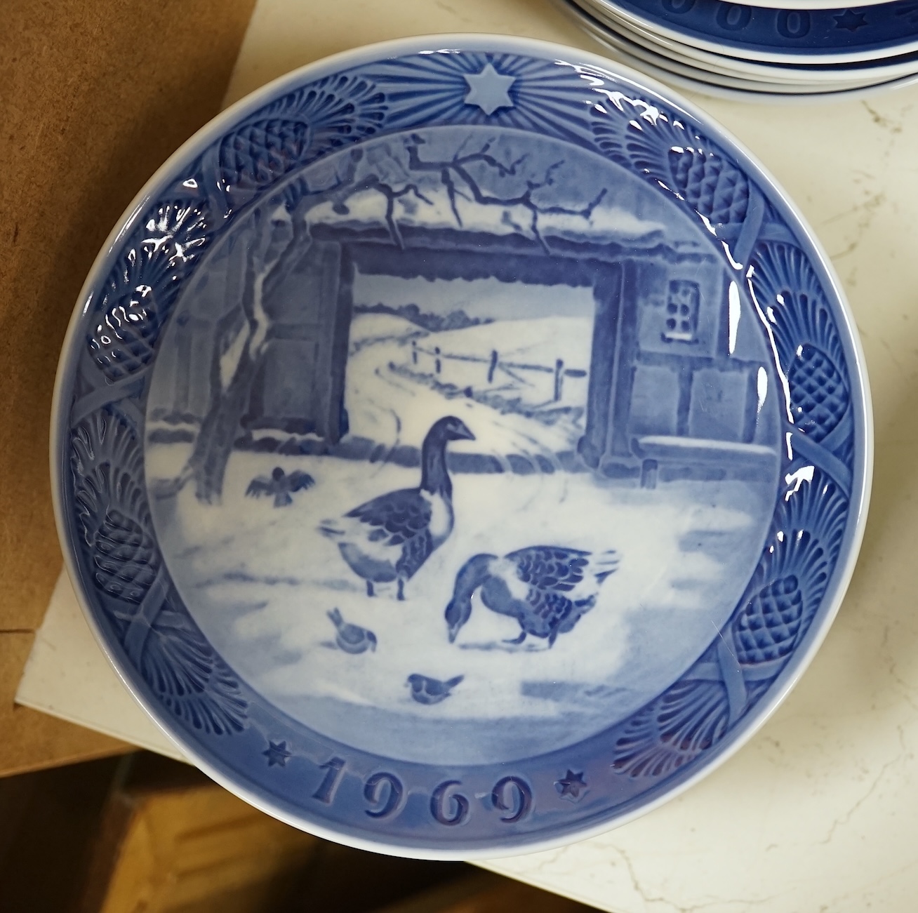 A large collection of Royal Copenhagen Christmas plates to include In the old farmyard, 1969 and In the desert 1972, with three boxes, each 18cm in diameter. Condition - good